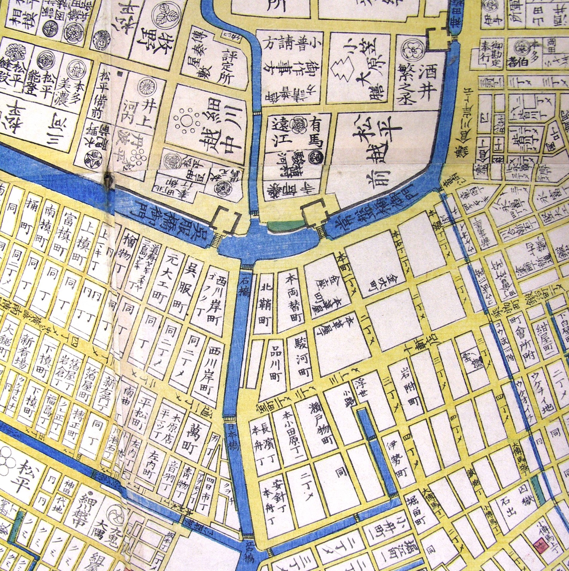 Image: a tour guide pointing to 'Kin-za' during the Edo Period on a historical map, showing the area of the Head Office today