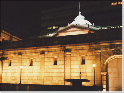 Image: exterior view of the Main Building lit up at night